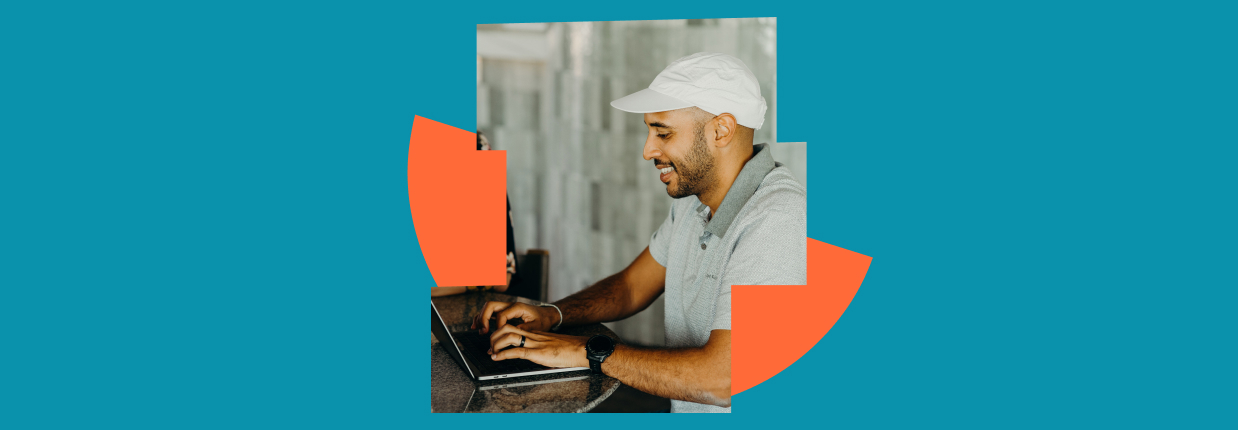 Professional working on laptop with graphic elements representing account-based marketing strategy