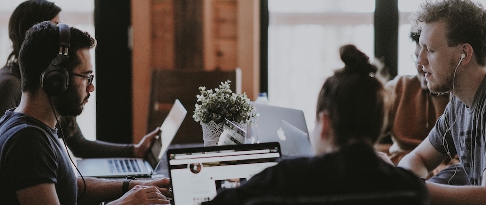A growth marketing team working at a table.