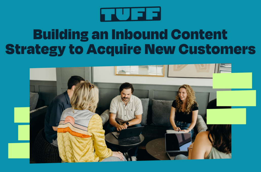 A collaborative team meeting with a laptop, illustrating the development of an inbound content strategy