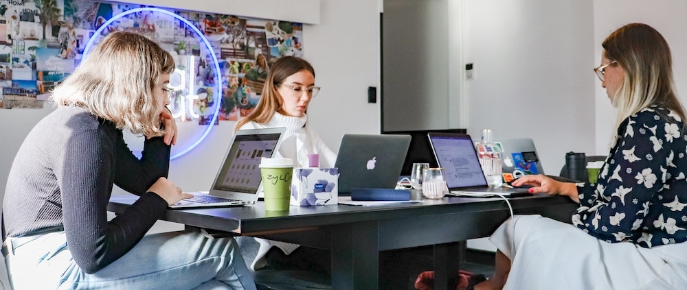 women working on a computer