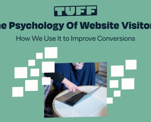 Blog title 'The Psychology Of Website Visitors: How We Use It to Improve Conversions' with an individual interacting with a laptop
