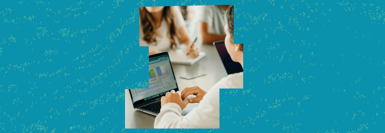 Close-up of hands typing and analyzing data on a laptop relevant to creative testing framework