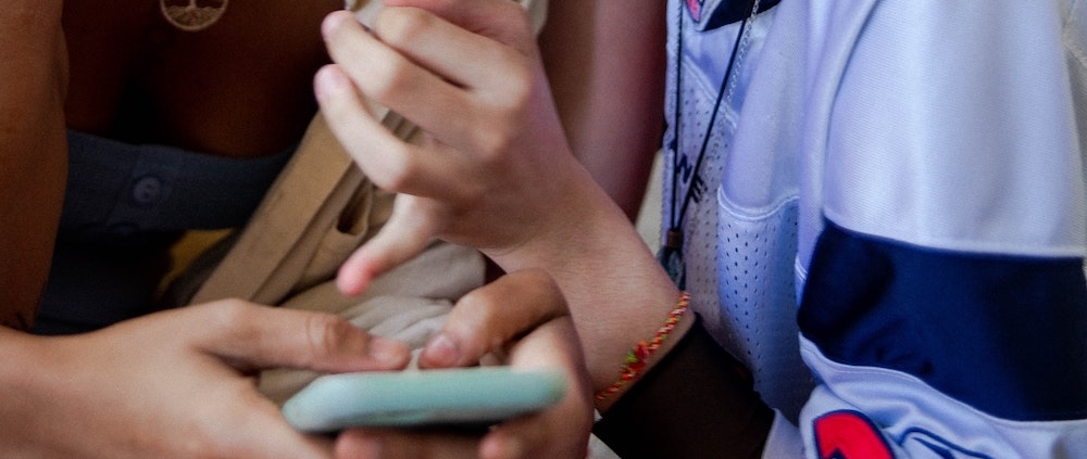 two women scrolling on TikTok